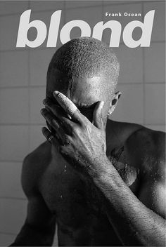 a black and white photo of a shirtless man covering his face with his hands