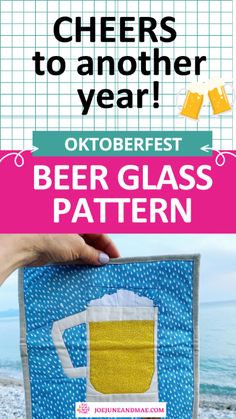 a person holding up a beer glass with the text cheers to another year oktoberfest