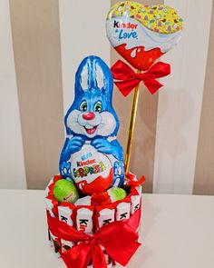 an easter basket with candy, candies and lollipops