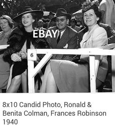 black and white photograph of people in hats at an event