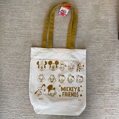 Bnwt Daiso X Disney Mickey Mouse And Friends Canvas Tote Bag In Natural/Mustard Yellow. This Can Be Your Next Everyday Tote Bag To Show Your Love For Disney. There Are Just Some Marks On The Bottom Of The Tote Bag But Should Come Off When You Hand Wash It. Material 70% Polyester 22% Cotton 7% Rayon & 1% Elastin/Polyurethane Size Length 13” X Height 15” Width 3.5” Disney Tote Bags, Disney Tote, Friend Canvas, Everyday Tote Bag, Painted Tote, Black Knit Sweater, Everyday Tote, Yellow Cream, Elephant Design