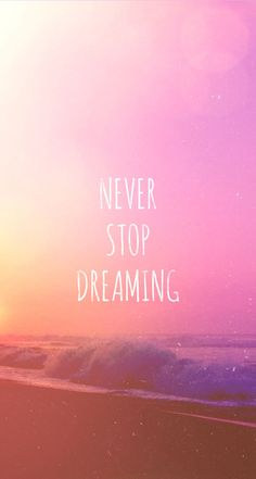 the words never stop dreaming are written in white on a pink and purple sunset background