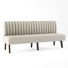 an upholstered bench with wooden legs on a white background