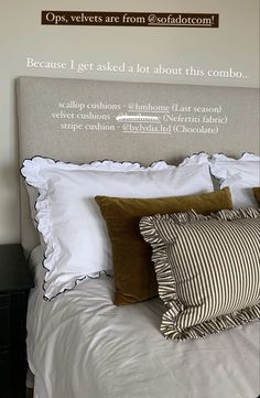 a bed with two pillows on it and a sign above the headboard that says, because i get asked a lot about this combo