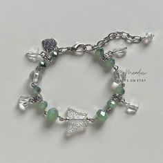 "Handmade sweet bracelet ✿ Made with glass beads, glass crystal beads, and metal accents ✿ Silver, mint, forest green, and iridescent clear ✿ The bracelet has an additional 1 - 1.5\" of extension chain" Jewelry Aesthetic Green, Wired Bracelet, Kou Diabolik Lovers, Butterfly Bracelets, Fairy Bracelets, Metal Jewelry Making, Gelang Manik-manik, Pola Gelang, Gelang Manik
