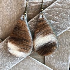 two pairs of brown and white fur earrings