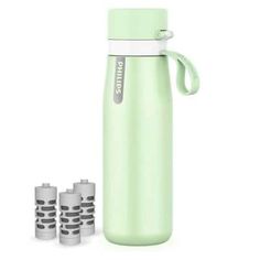 thermos stainless steel water bottle in mint green with four cups next to it