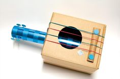 a wooden toy with a blue tube attached to it