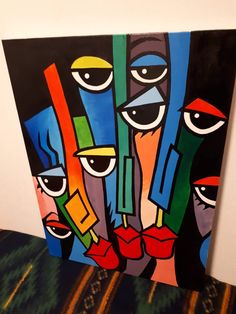 an abstract painting with multiple faces on it