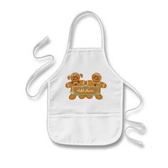 a child's apron with a teddy bear holding a heart