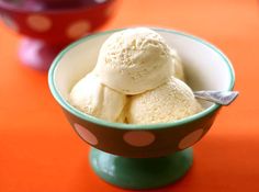 a bowl filled with ice cream sitting on top of a table