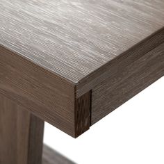 a close up view of the top of a table with wood grained finish on it