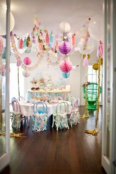 an image of a birthday party with balloons and decorations