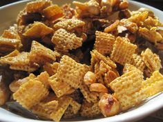 a white bowl filled with cereal and nuts