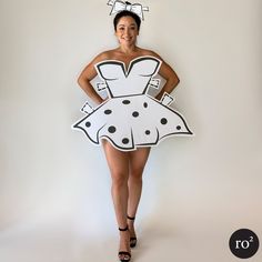 a woman wearing a dress made out of cardboard