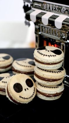 cookies decorated like jack - o'- lanterns stacked on top of each other