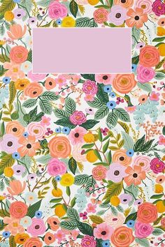 an open notebook with flowers and leaves on the cover, in pastel pink tones