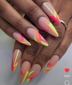 Nails Design Summer - Neon Lightning Nails: Matte nude nails featuring striking neon geometric lines in pink, orange, and yellow. These nails create a dynamic and edgy look, perfect for making a statement. Pink White Grey Living Room, Monochromatic Nail Art, Fluorescent Nail Designs, Nails For Miami Trip, Miami Inspired Nails, Neon Acrylic Nails Designs, Stiletto Spring Nails, Fabulous Nails Summer, Stilleto Nails Designs Summer