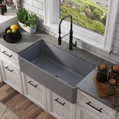 a kitchen sink sitting on top of a counter next to a cutting board and knife