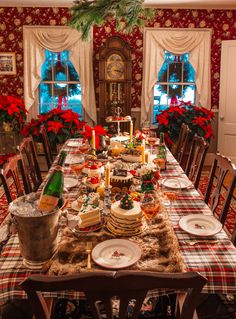 a dining room table set for christmas dinner