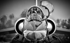 black and white photograph of the nose of an airplane