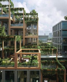 an apartment building with plants growing on the balconies