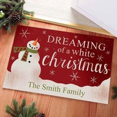 a christmas door mat with a snowman and the words dreaming of a white christmas