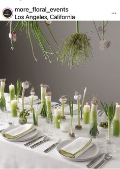 an image of a table setting with flowers and candles