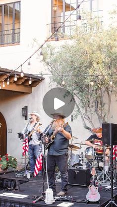 the band is playing outside on stage