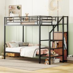 a black bunk bed sitting on top of a wooden floor next to a book shelf