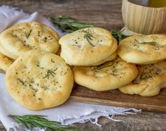 small biscuits with herbs on a wooden cutting board