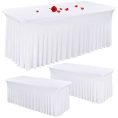 three white tables with red hearts on them