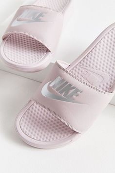 Nike Just Do It slides are equipped with massaging texture foot beds phylon cushion soles to give your feet some much needed post-workout TLC #women #shoes #footwear #product #shoe Pink Nike Slides, Nike Slide, Nike Slippers, Nike Sandals, Nike Benassi, Nike Slides, Pink Nike, Shoes Collection, Womens Shoes High Heels