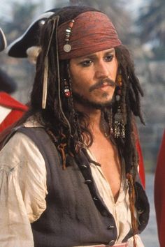 a man dressed as captain jack sparrow on the set of pirates of the carraige