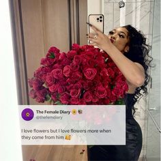 a woman taking a selfie in front of a bouquet of roses with her phone