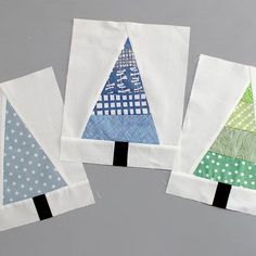four small pieces of fabric with different designs on them, all in blue and green