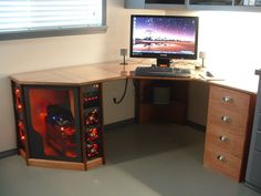 a desk with a computer on top of it