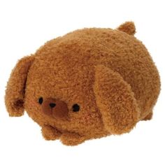 a brown teddy bear laying on top of a white surface with its eyes closed and nose wide open