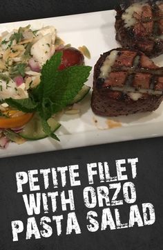 two steaks and salad on a plate with the words petite fillet with orzo pasta