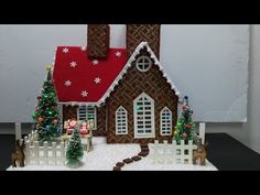 a gingerbread house decorated with christmas decorations