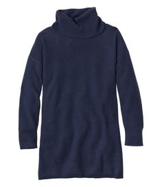 a women's turtle neck sweater in dark blue, with the hood pulled up