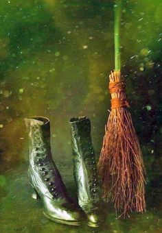 a pair of boots and a broom in the water