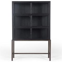 a black bookcase with four shelves and two doors on the front, against a white background