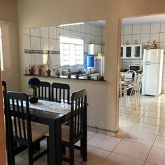 a kitchen and dining room with tile flooring