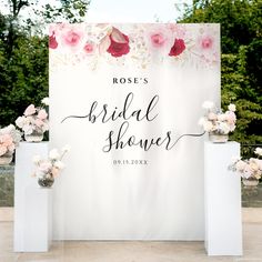 a sign that says rose's bridal shower on it with flowers around it