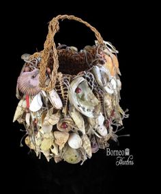 a basket filled with seashells sitting on top of a table