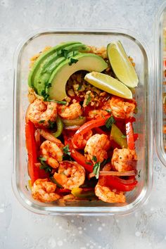 two plastic containers filled with shrimp, peppers, and avocado on top of a table