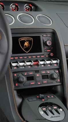 the interior of a sports car with dashboard controls