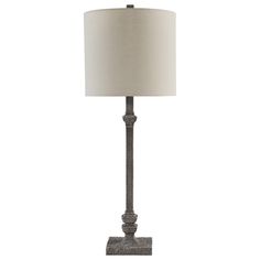 a lamp with a white shade on it