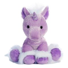 a purple and white stuffed animal sitting on the ground